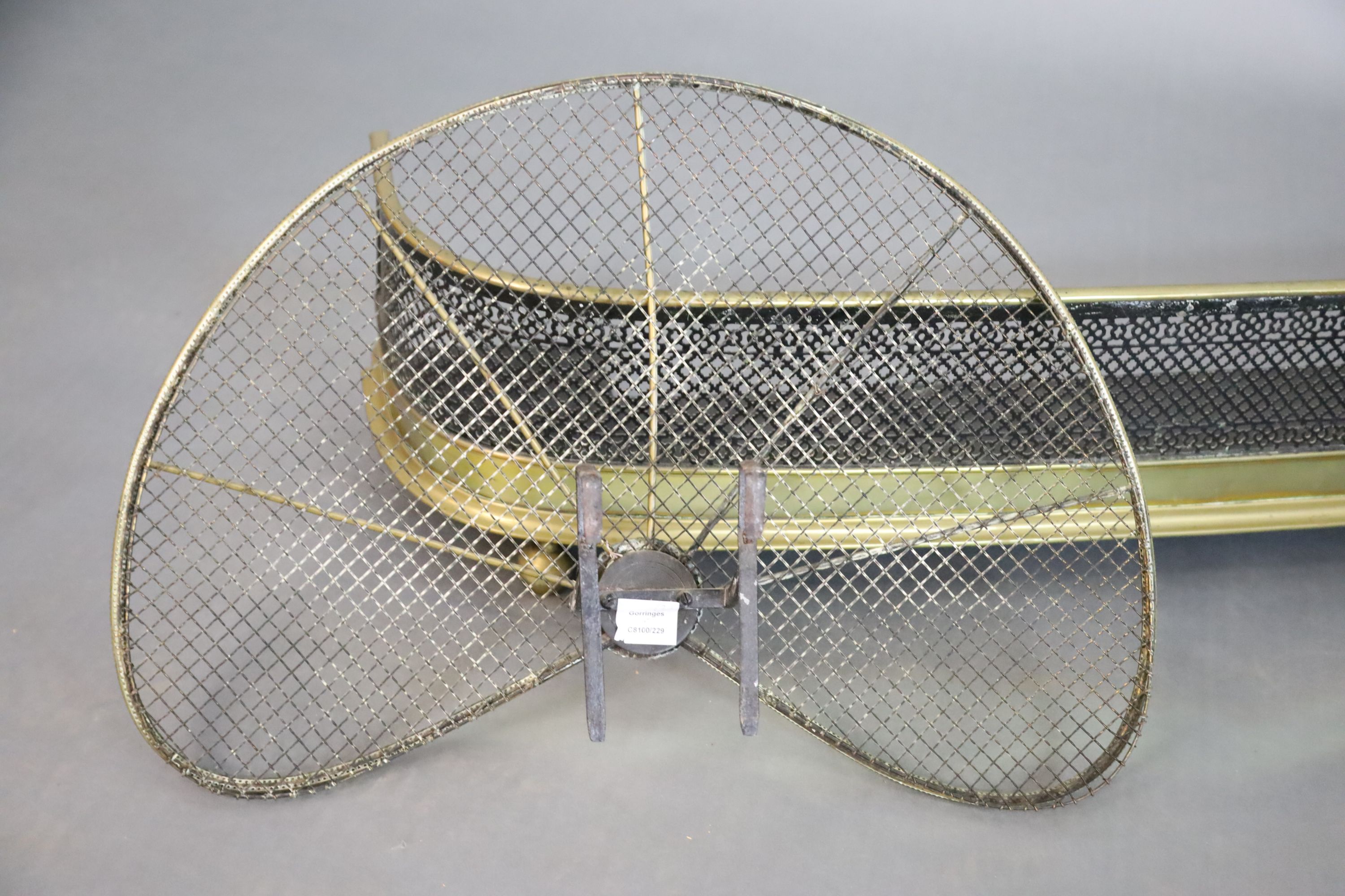 A Regency brass and wire mesh bow fronted kerb and a brass fan shaped spark guard, kerb W.119.5cm D.25.5cm H.27cm guard W.71cm H.46cm